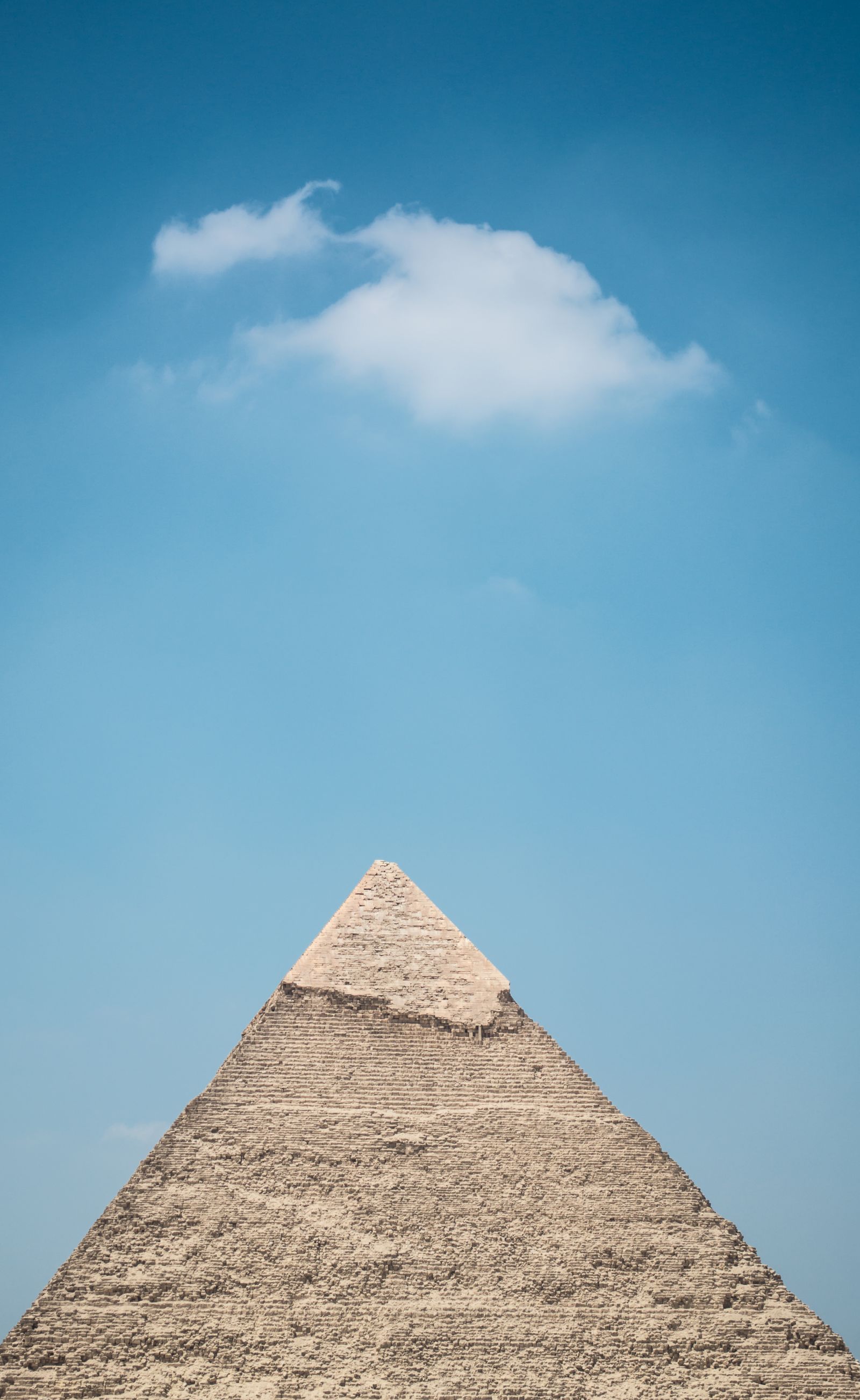 Pyramid silhouette in desert light