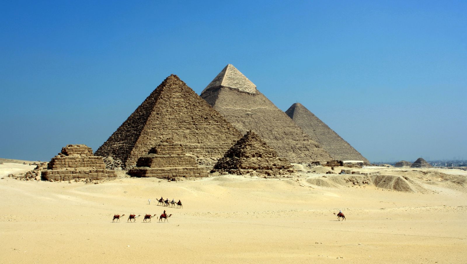 Pyramids of Giza under a vast Egyptian sky